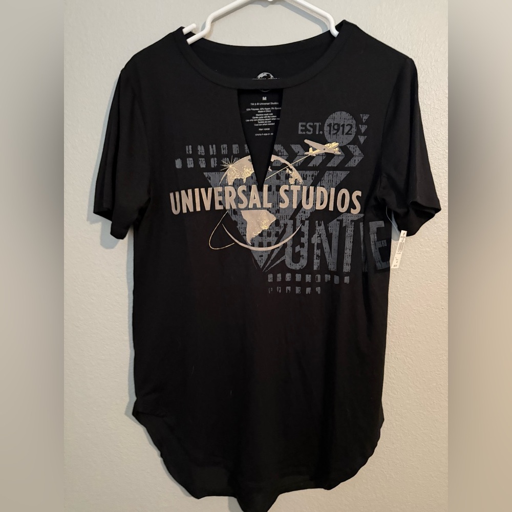 NWT Universal Studios Black and Gold Graphic Tee with front cut-out